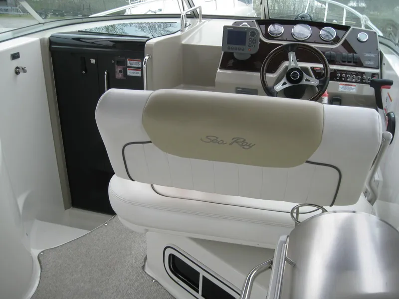Slide: The Image of Interior of a 2009 Sea Ray 270 Sundancer with helm station. - 14