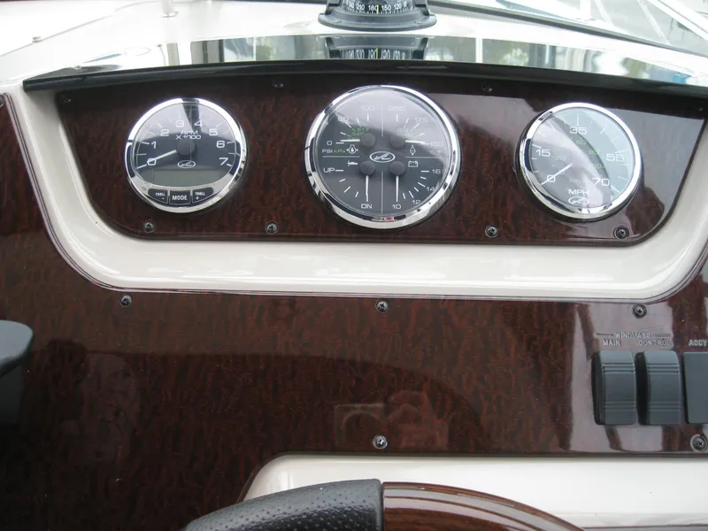Slide: The Image of Dashboard of 2009 Sea Ray 270 Sundancer with gauges. - 19