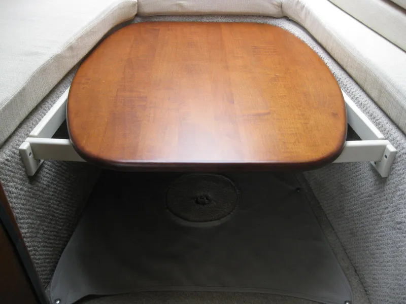 Slide: The Image of Interior of 2009 Sea Ray 270 Sundancer with wooden table. - 26