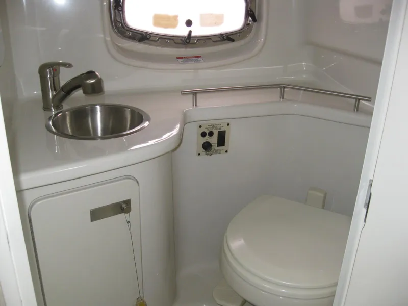 Slide: The Image of Interior of 2009 Sea Ray 270 Sundancer with sink and toilet. - 31