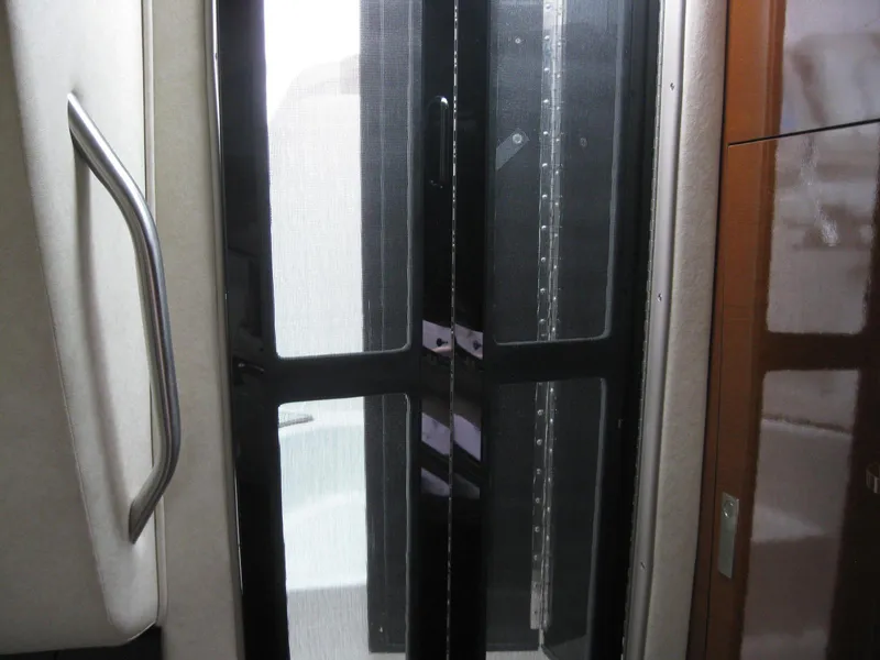Slide: The Image of Interior of 2009 Sea Ray 270 Sundancer with glass door. - 33
