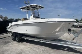 The Image of 2023 Trophy T24 CC boat on trailer under clear blue sky. - 1