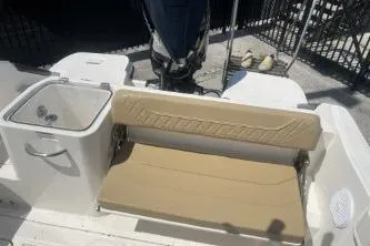 Slide: The Image of 2023 Trophy T24 CC boat interior with beige seating and storage compartments. - 12