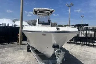 Slide: The Image of 2023 Trophy T24 CC boat on trailer in outdoor lot. - 3