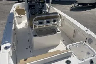 Slide: The Image of 2023 Trophy T24 CC boat interior with seating and console, showcasing modern design and functionality. - 7