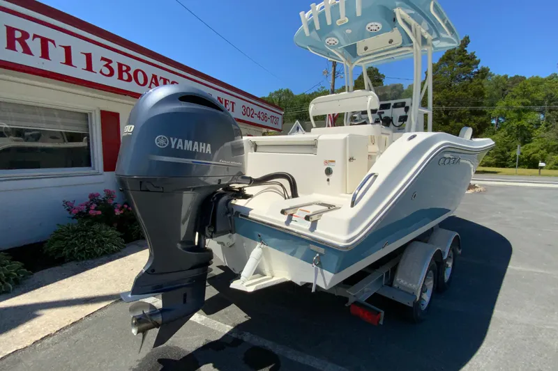 Slide: The Image of 2021 Cobia 220 Center Console boat with Yamaha engine on trailer. - 10