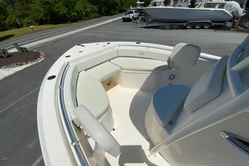 Slide: The Image of 2021 Cobia 220 Center Console boat with spacious seating and sleek design. - 20