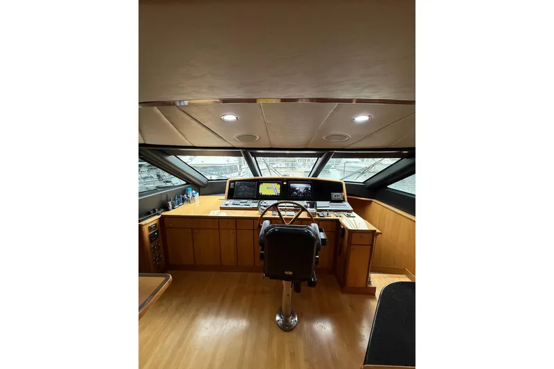 Slide: The Image of Luxurious helm of 2004 Queenship 76 Baretta yacht with modern navigation equipment. - 39