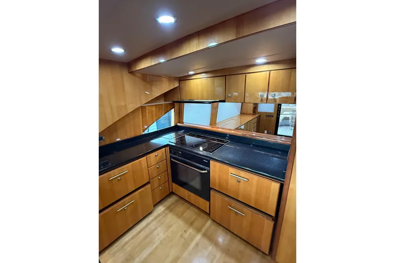 Slide: The Image of Luxurious kitchen interior of 2004 Queenship 76 Baretta yacht with modern appliances. - 41