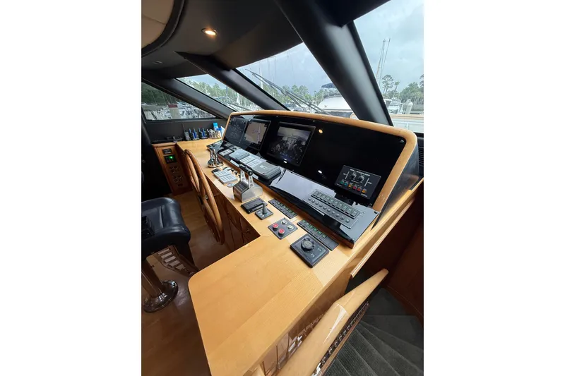 Slide: The Image of Luxurious helm of 2004 Queenship 76 Baretta yacht with advanced navigation systems. - 56