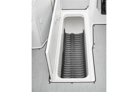 Slide: The Image of 2026 Yamaha Boats AR195 storage compartment with black mat, open hatch view. - 10