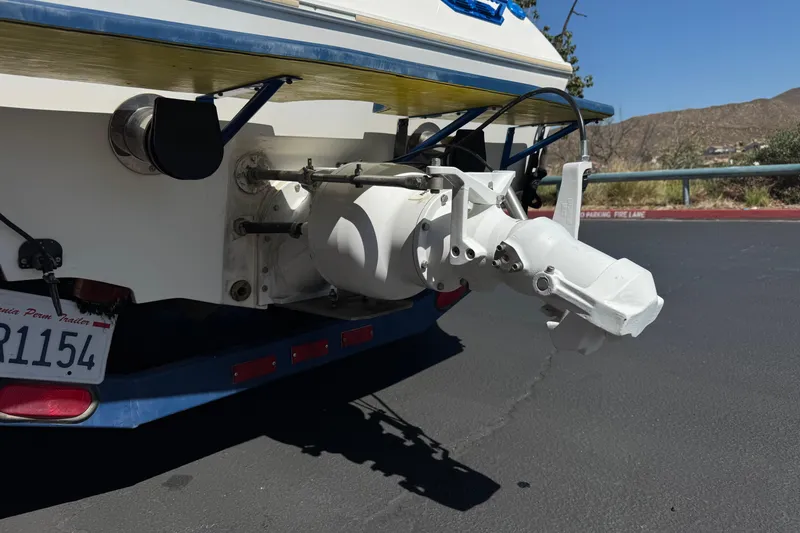 Slide: The Image of Rear view of a 2007 Commander 2300LX boat showing the outdrive and trailer. - 6