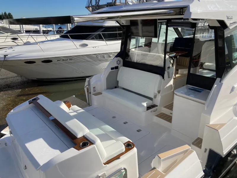 Slide: The Image of The image shows a luxurious 2027 Tiara Yachts 39LE with sleek white seating and modern design. - 3