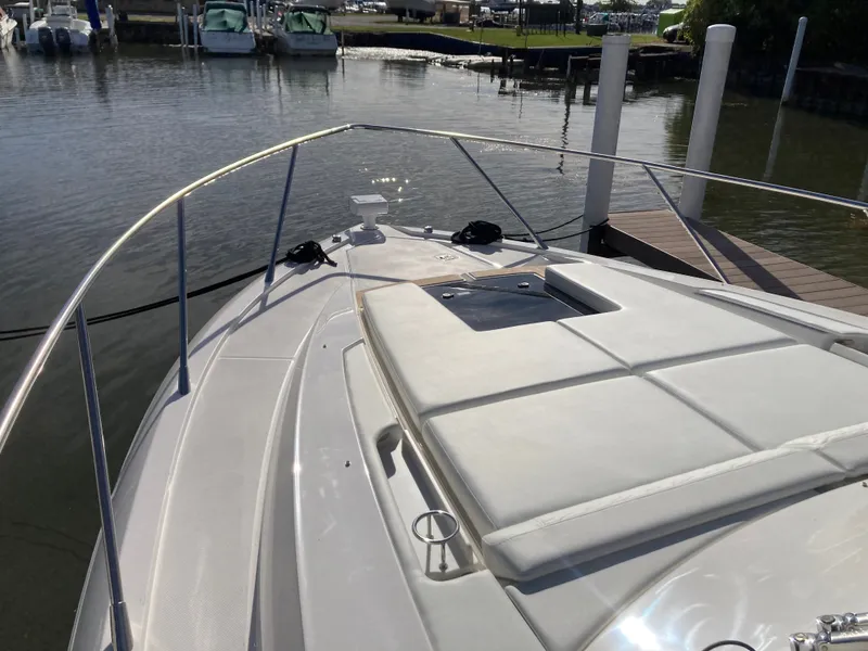 Slide: The Image of The foredeck of a 2027 Tiara Yachts 39LE with sun pad and railing. - 46