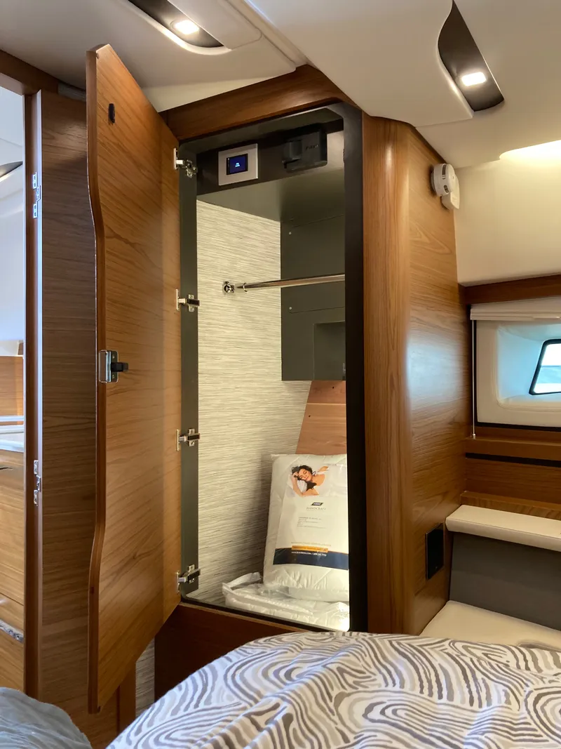 Slide: The Image of Interior of Tiara Yachts 39LE featuring wooden cabinets and a bed. - 38