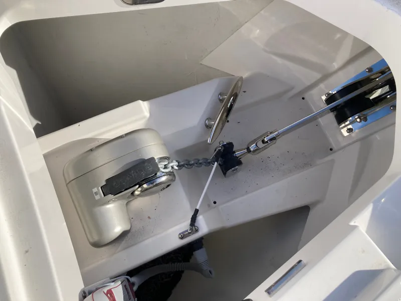 Slide: The Image of Close-up of an anchor system in a boat, featuring chain and winch. - 44