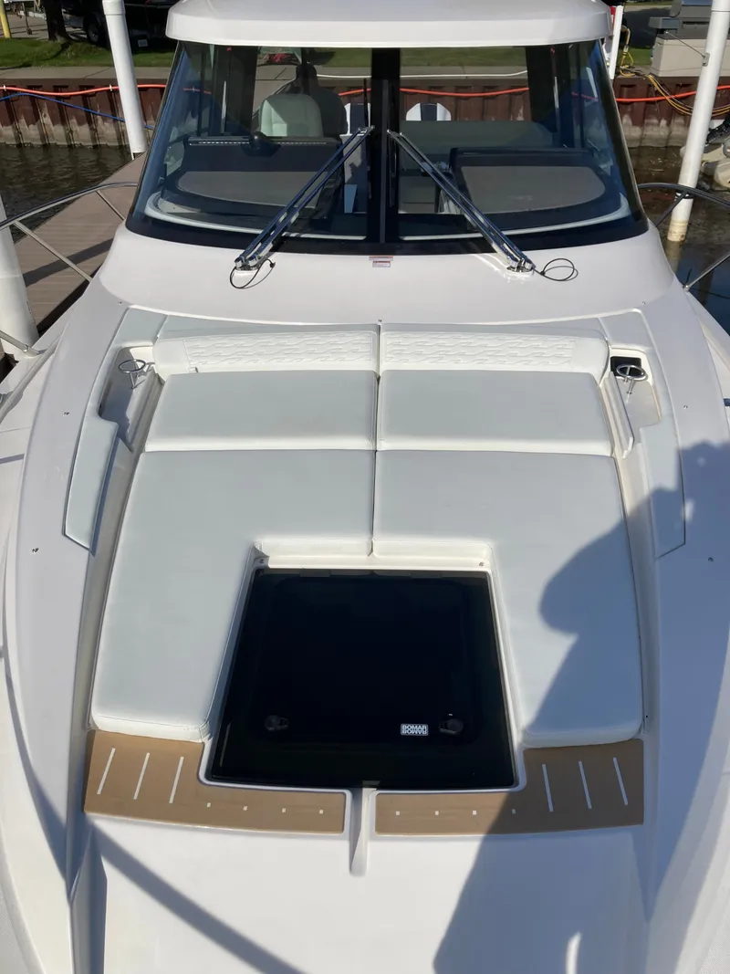 Slide: The Image of The image shows the foredeck of a 2027 Tiara Yachts 39LE with white cushions. - 40