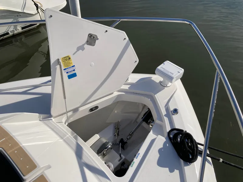 Slide: The Image of The 2027 Tiara Yachts 39LE features an open storage compartment in the bow area with stainless steel railing. - 43