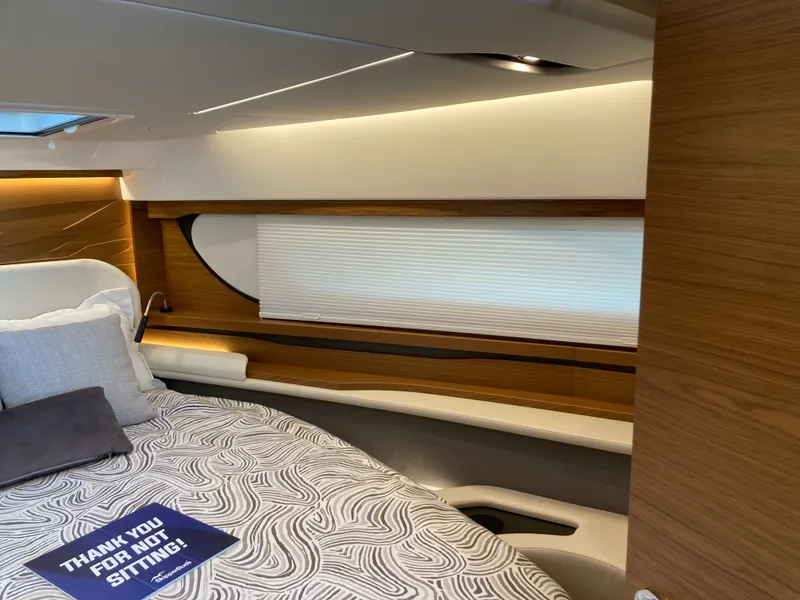 Slide: The Image of Interior of a 2027 Tiara Yachts 39LE with modern design and cozy bed. - 26
