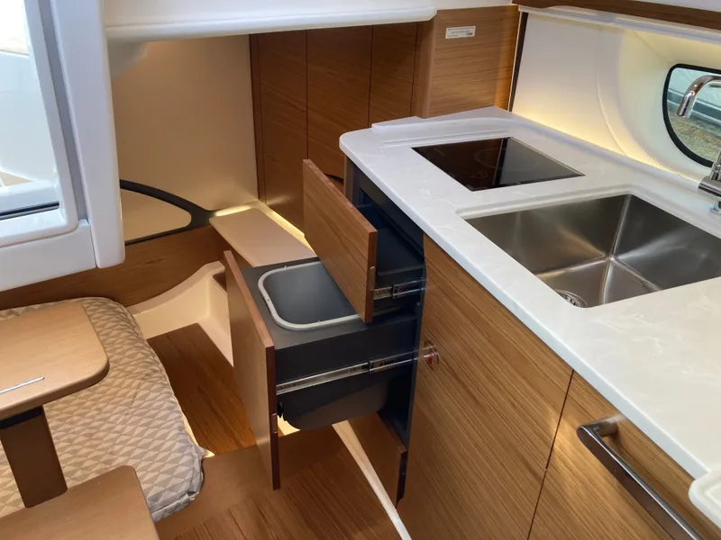 Slide: The Image of Interior of a 2027 Tiara Yachts 39LE featuring a modern kitchen and dining area. - 37
