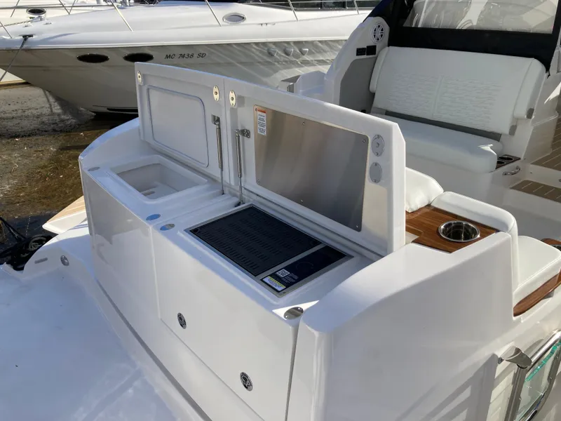Slide: The Image of The 2027 Tiara Yachts 39LE features a modern outdoor kitchen with a grill and sink. - 5