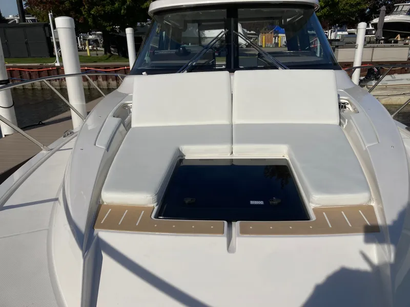 Slide: The Image of The 2027 Tiara Yachts 39LE features a sleek deck with comfortable seating and a glass window. - 41