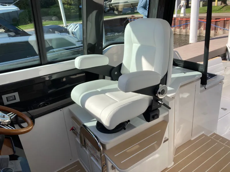 Slide: The Image of The interior of a 2027 Tiara Yachts 39LE features a luxurious white captain's chair. - 20