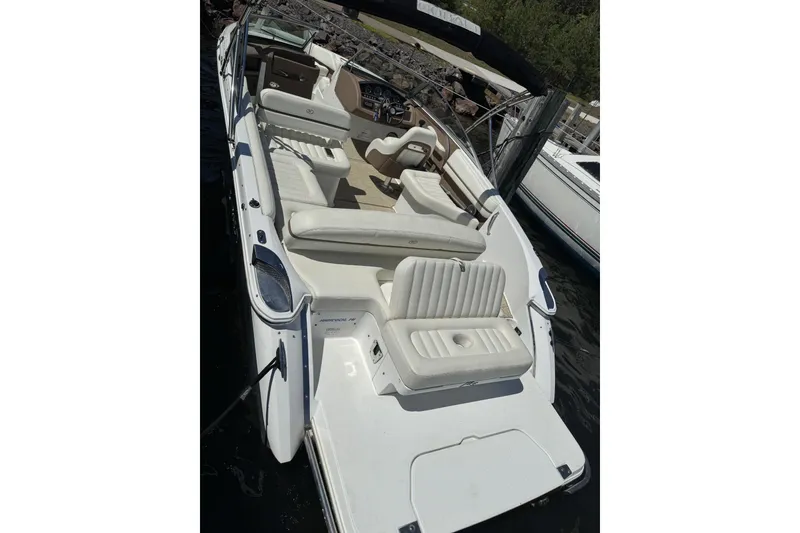 Slide: The Image of 2014 Cobalt R5 boat with spacious seating, docked by the water. - 1