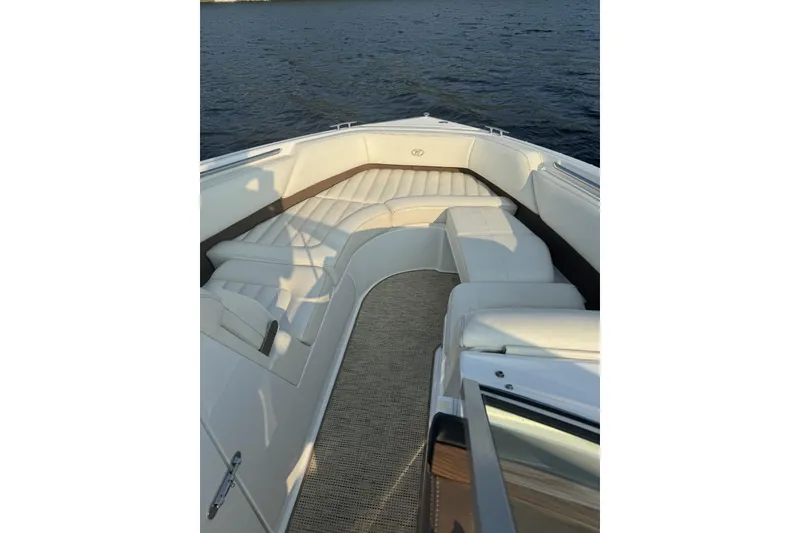 Slide: The Image of 2014 Cobalt R5 boat interior with white seating and lake view. - 2