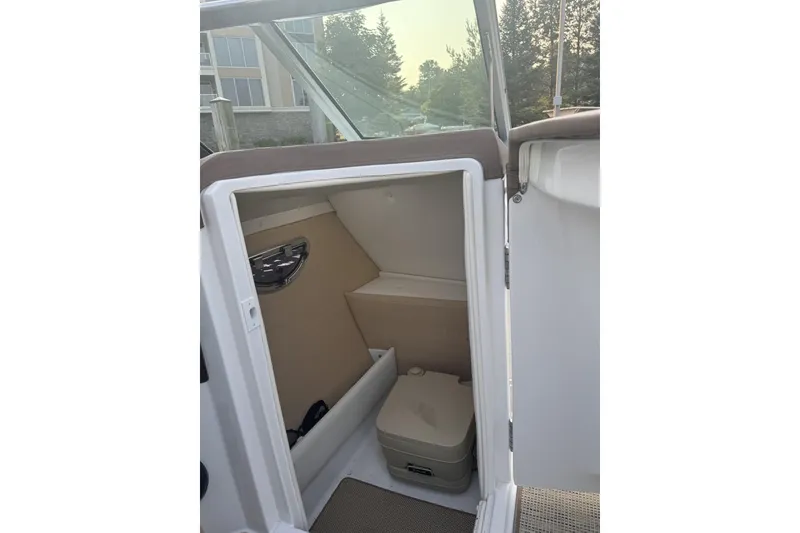 Slide: The Image of 2014 Cobalt R5 boat interior with compact restroom compartment. - 6