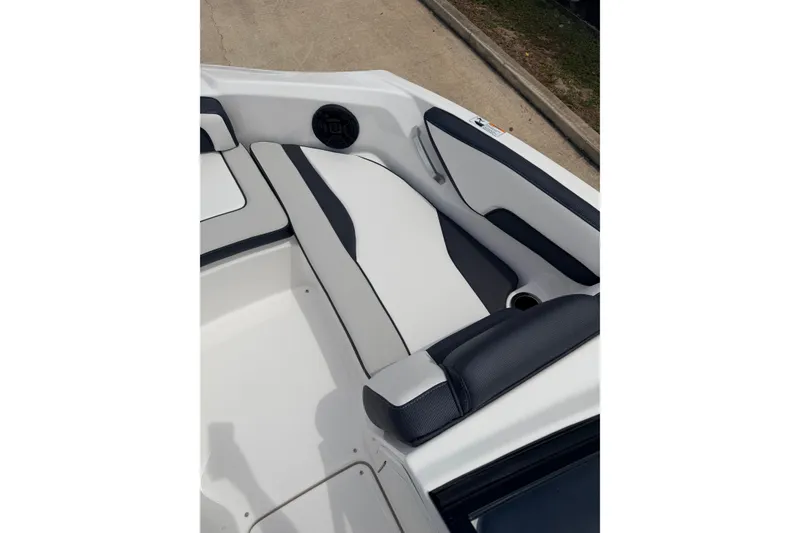Slide: The Image of Interior seating of 2026 Yamaha Boats SX195, featuring sleek black and white upholstery. - 12