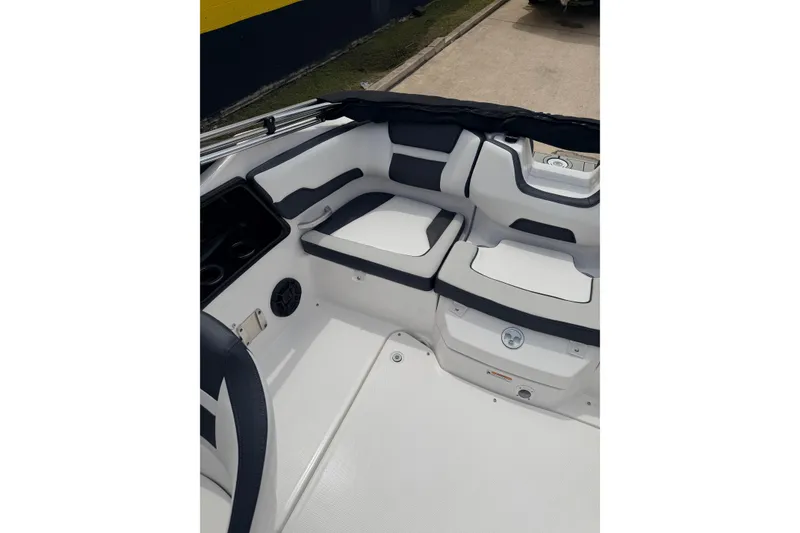 Slide: The Image of 2026 Yamaha Boats SX195 interior seating with sleek white and gray design. - 14