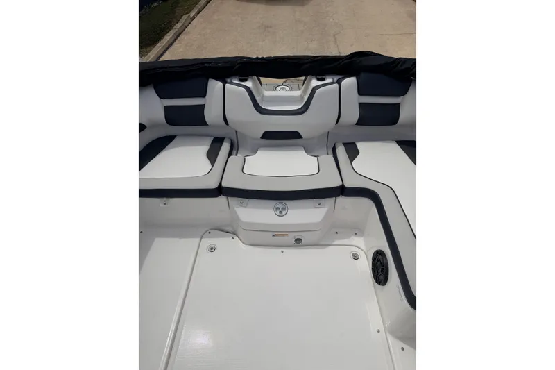 Slide: The Image of 2026 Yamaha Boats SX195 interior seating with sleek white and black design. - 15