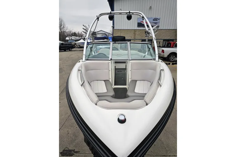 Slide: The Image of 2005 MasterCraft X-2 boat with sleek white interior and spacious seating. - 12