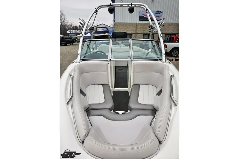 Slide: The Image of 2005 MasterCraft X-2 boat interior with gray seating and wakeboard tower. - 13