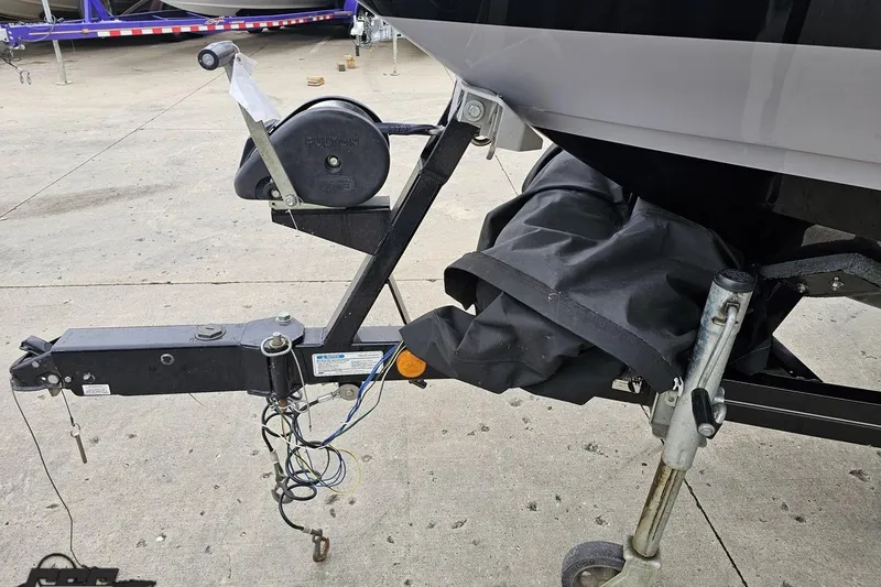 Slide: The Image of Trailer hitch and winch of a 2005 MasterCraft X-2 boat on concrete surface. - 14