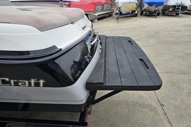 Slide: The Image of 2005 MasterCraft X-2 boat rear view with swim platform in storage area. - 26
