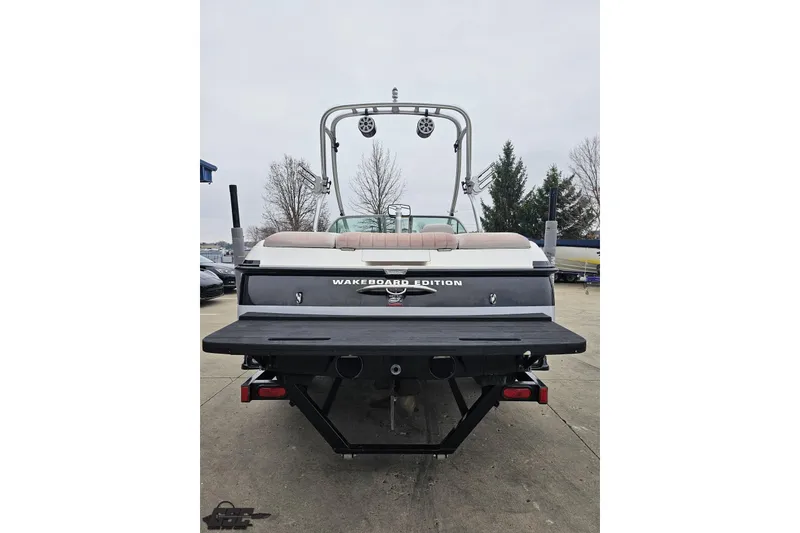 Slide: The Image of 2005 MasterCraft X-2 Wakeboard Edition boat, rear view with tower and speakers. - 27