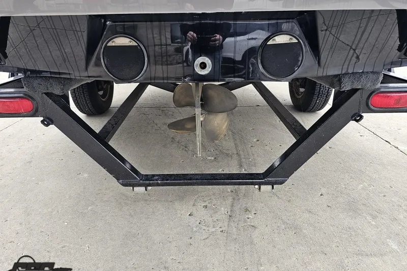 Slide: The Image of Rear view of a 2005 MasterCraft X-2 boat on a trailer, showing propeller and exhaust. - 29