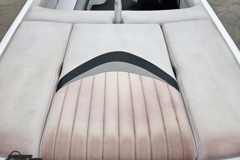 Slide: The Image of 2005 MasterCraft X-2 boat interior with cushioned seating and stylish upholstery design. - 32