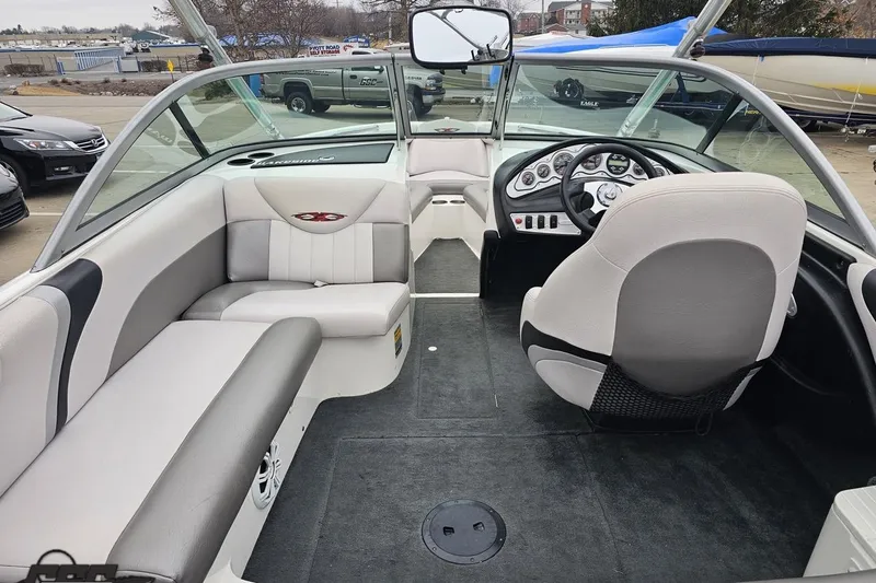 Slide: The Image of 2005 MasterCraft X-2 boat interior with sleek seating and modern dashboard design. - 36