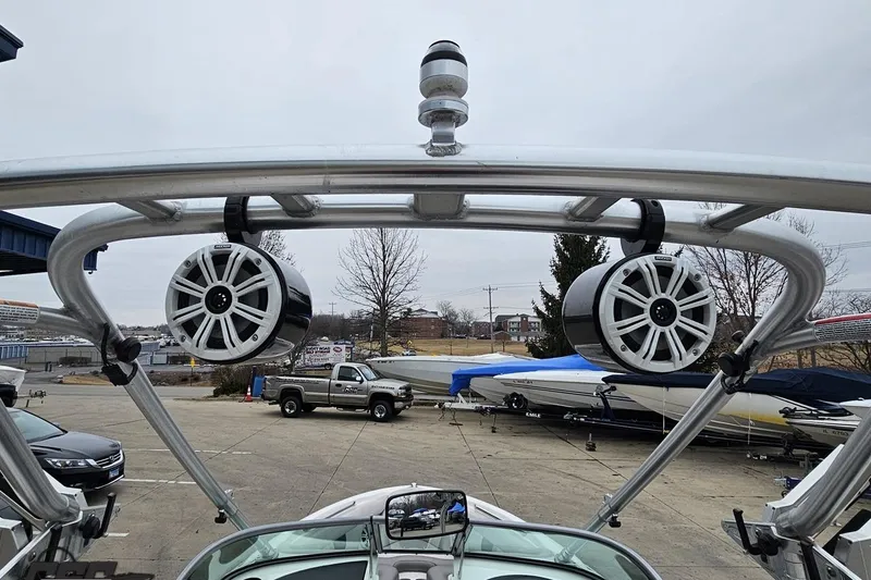 Slide: The Image of 2005 MasterCraft X-2 boat with tower speakers in a marina setting. - 38