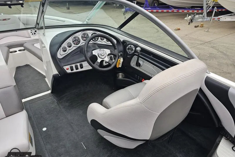 Slide: The Image of 2005 MasterCraft X-2 boat interior with steering wheel and dashboard controls. - 41