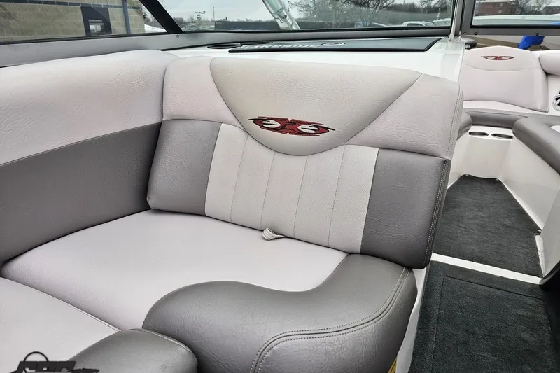 Slide: The Image of 2005 MasterCraft X-2 boat interior with gray and white seating, featuring embroidered logo. - 47