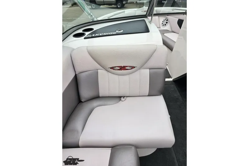 Slide: The Image of 2005 MasterCraft X-2 boat interior with gray seating and "Wakeside" branding. - 48