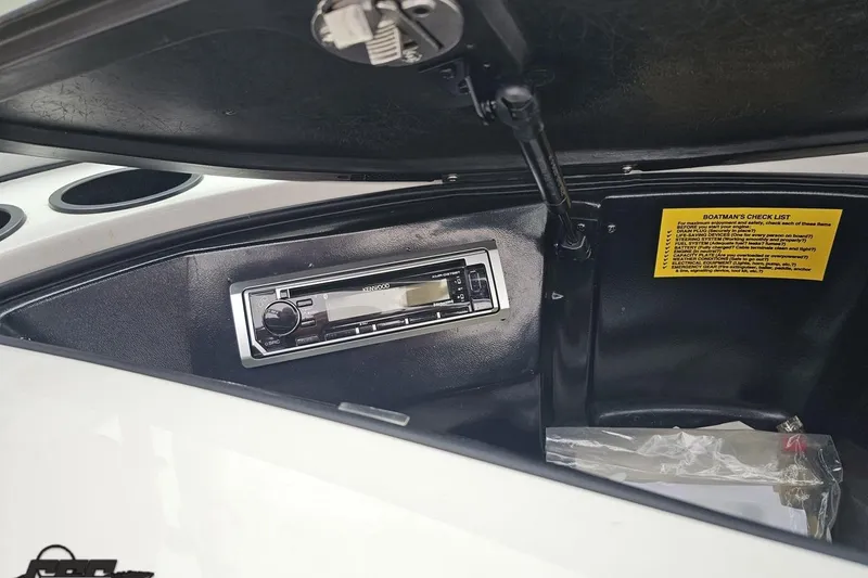 Slide: The Image of 2005 MasterCraft X-2 boat dashboard with Kenwood stereo and checklist. - 51