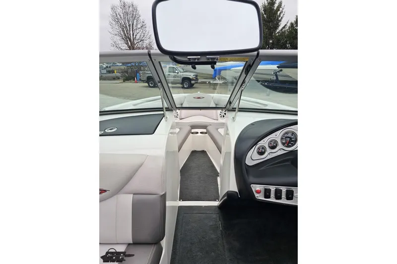 Slide: The Image of Interior view of a 2005 MasterCraft X-2 boat, showcasing dashboard and seating area. - 53
