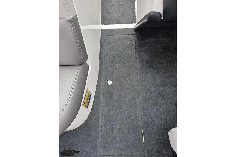 Slide: The Image of 2005 MasterCraft X-2 interior floor with gray carpet and seating detail. - 54