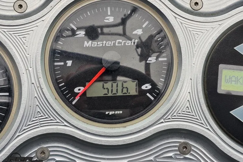 Slide: The Image of Close-up of 2005 MasterCraft X-2 tachometer displaying 506.1 RPM. - 61