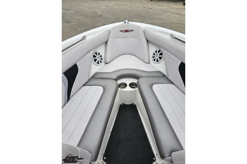 Slide: The Image of 2005 MasterCraft X-2 boat interior with gray seating and built-in speakers. - 63